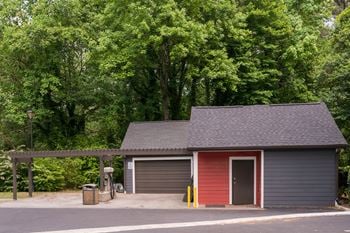 a parking lot with a garage and a fire hydrant at Elme Druid Hills, Georgia, 30329